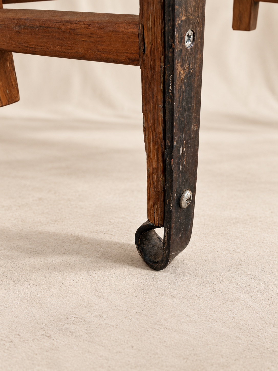 Detail of curled iron terminal on primitive wood sled