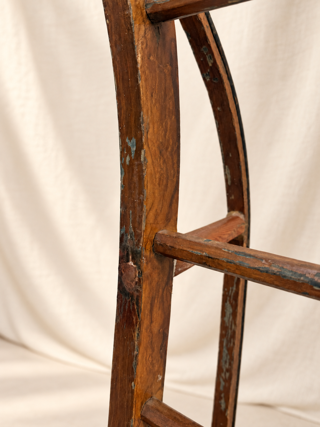 Antique wooden sled displayed as a decorative ladder-style rack