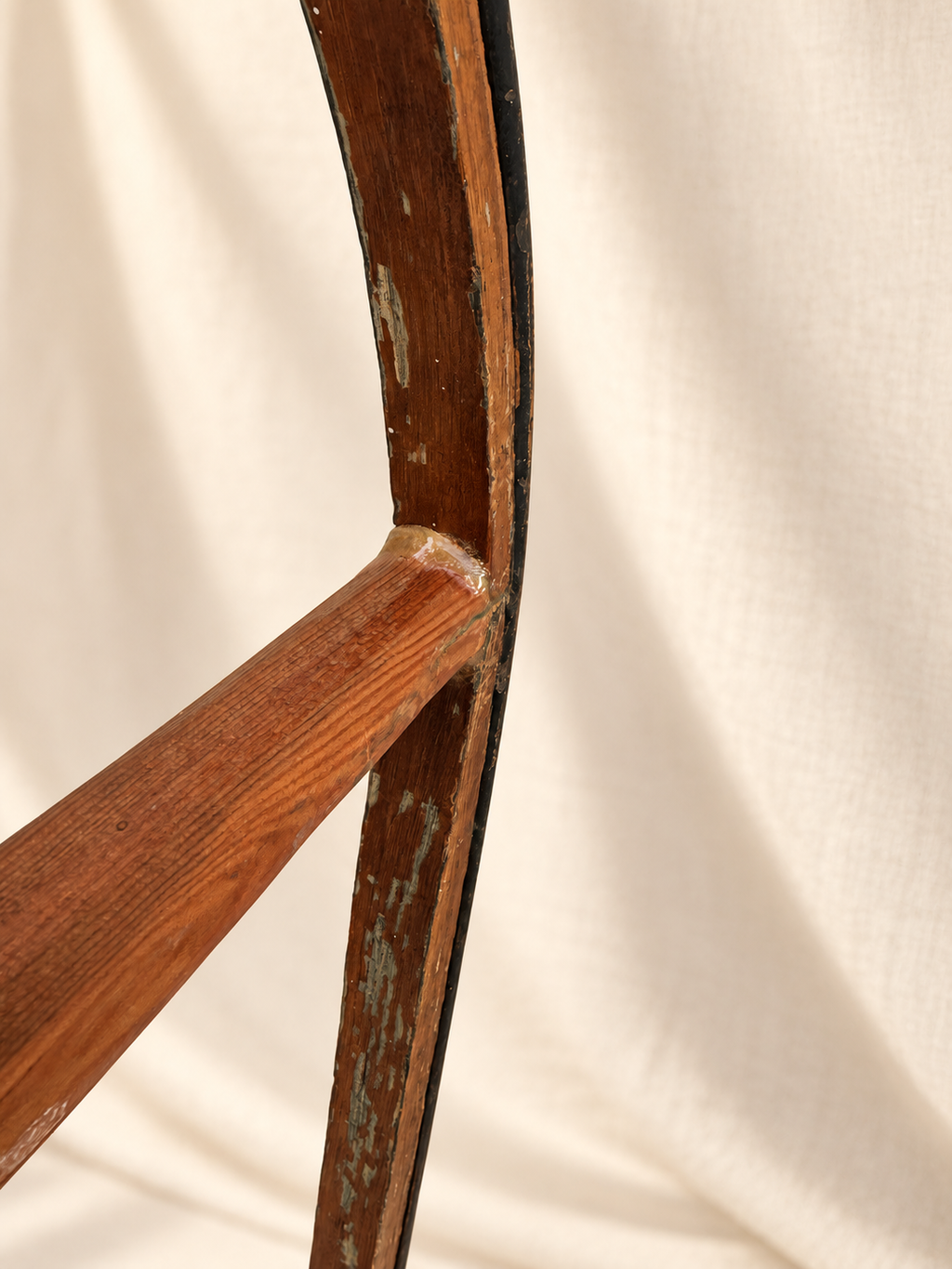 Side view of 19th-century wood sled with curved runners