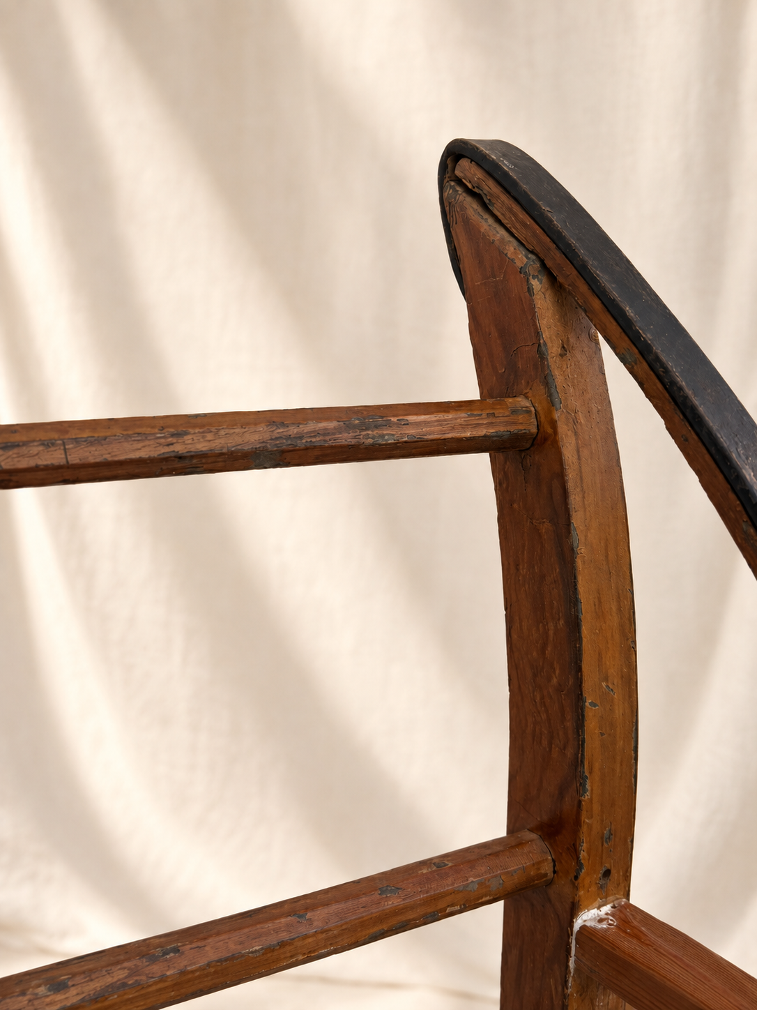 Detail of curled iron terminal on primitive wood sled