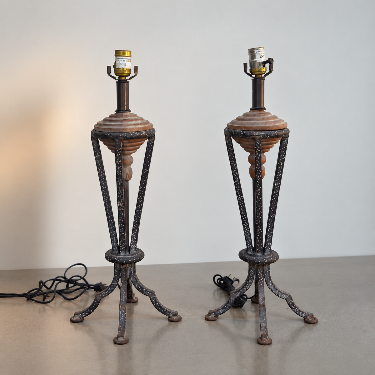 Pair of sculptural metal and wood table lamps with tapered open frames