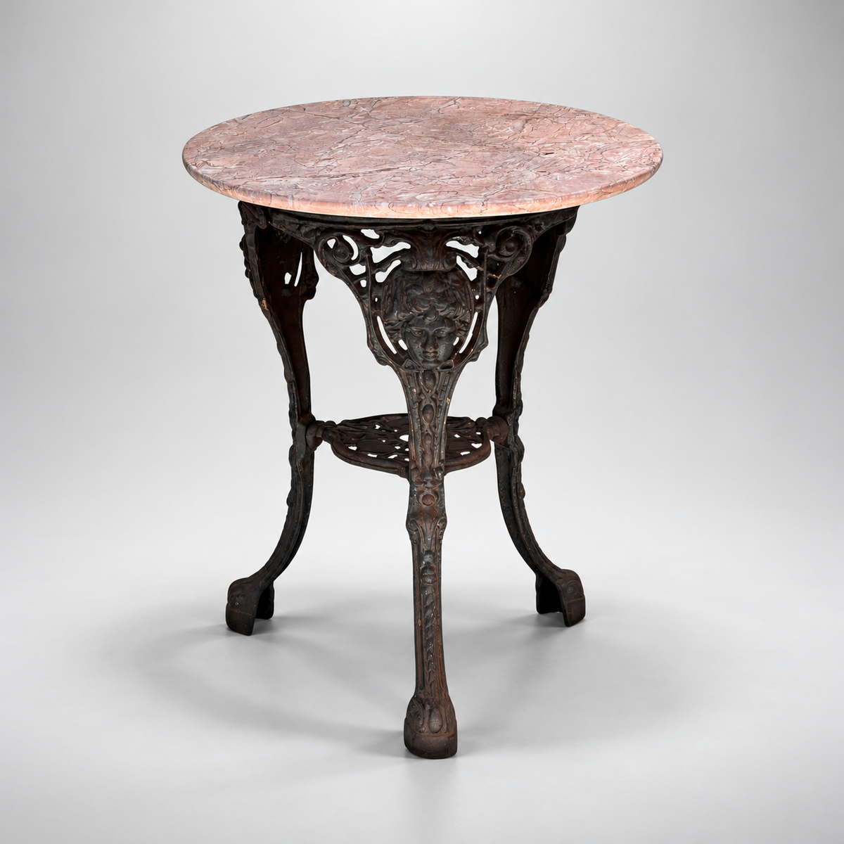 Mid-century cast iron Britannia pedestal table with ornate sculptural base and marble top, a vintage European-inspired accent table with architectural character — Hommes and Gardens, Furniture Collection, Objects + Curiosities Collection, Home Decor, Landscape Architect, Interior Designer, Outdoor Living, Home Design, Luxury Design, Art, Furniture, Objects, Vintage Furniture, European Design, Neoclassical Decor, Garden Design, Best Gifts.