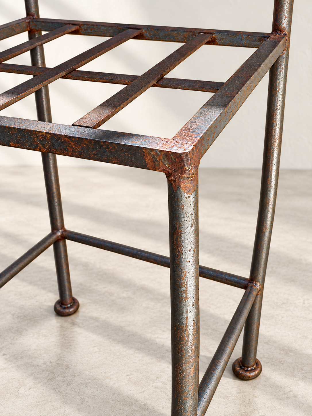 Close-up of black wrought iron frame and footrest