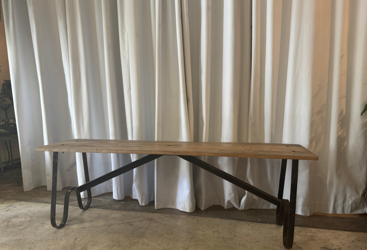 Sculptural wrought iron base on Chic Antique Grimaud bench