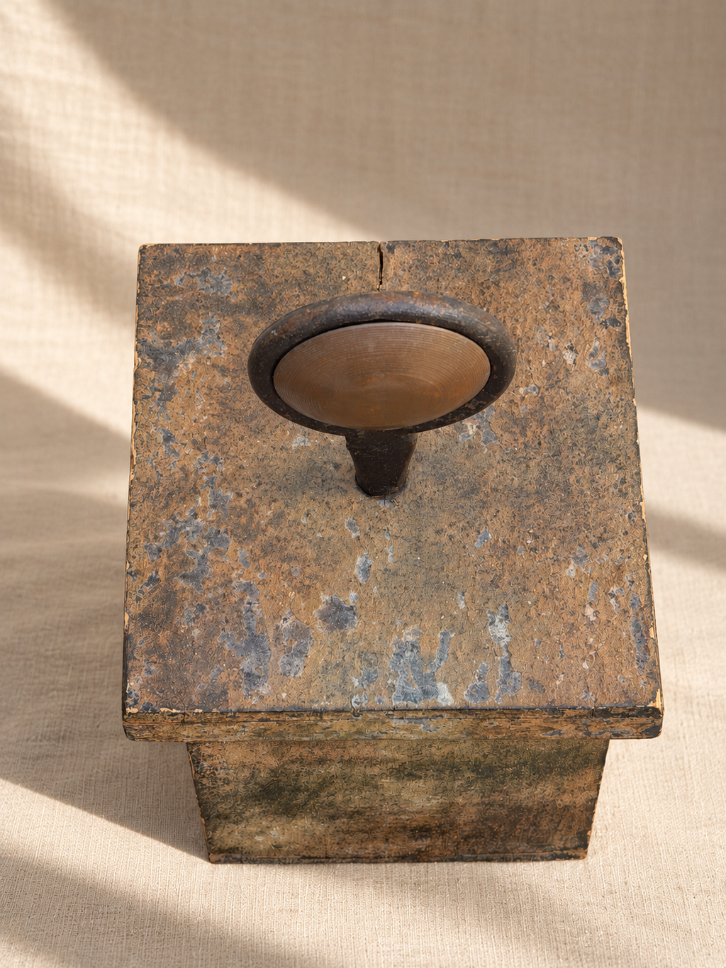 Black iron ring and copper disc detail on decorative box