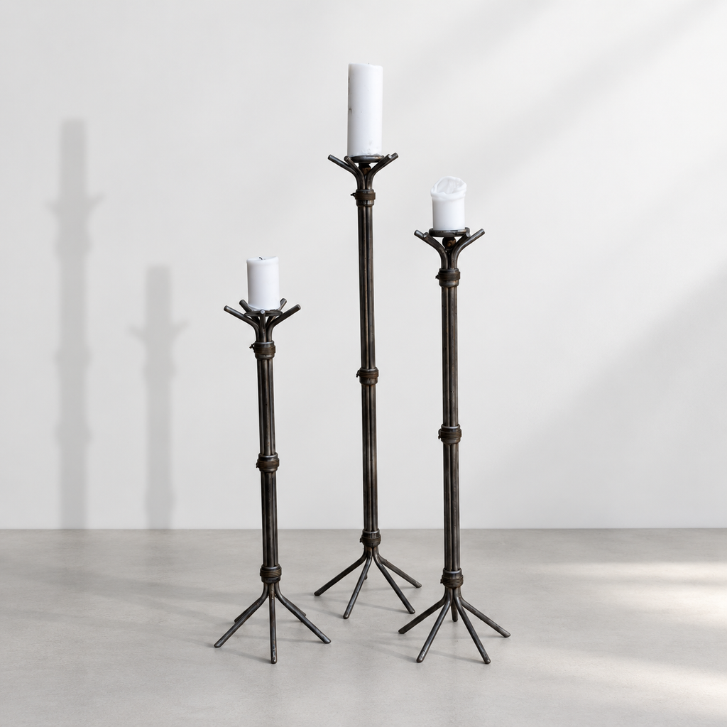 Set of three Brutalist iron floor pricket candlesticks in graduated heights