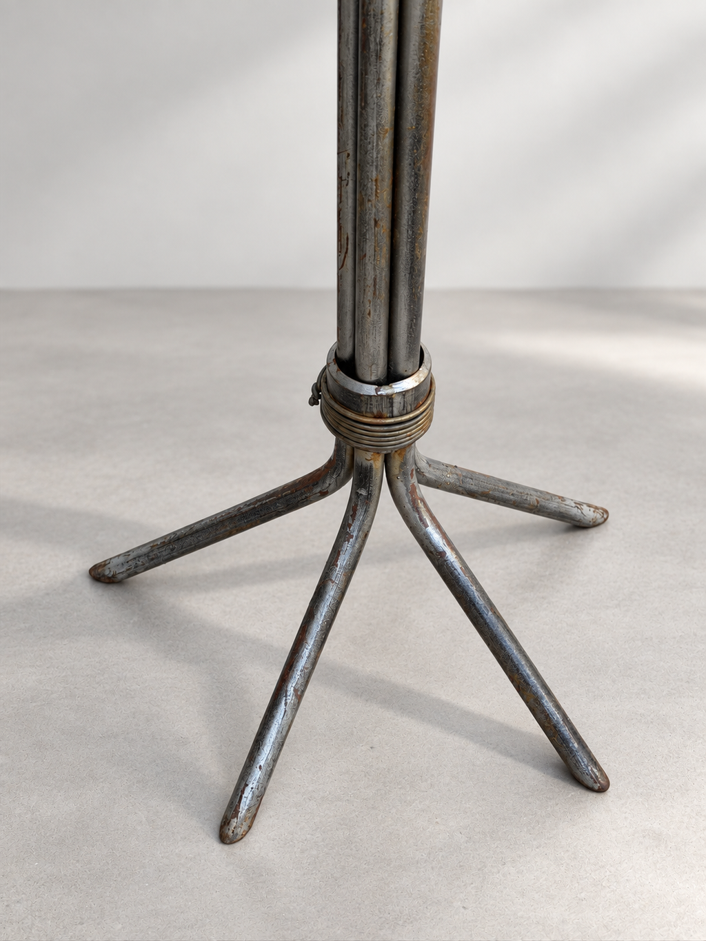 Splayed four-leg base of Brutalist iron floor candlestick
