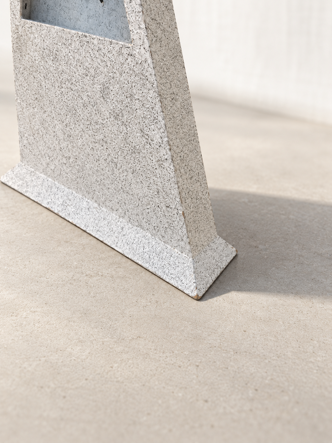 Sculptural triangular table clock with textured gray finish