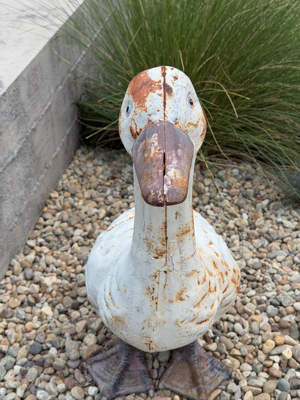 Front view of cast metal goose garden ornament