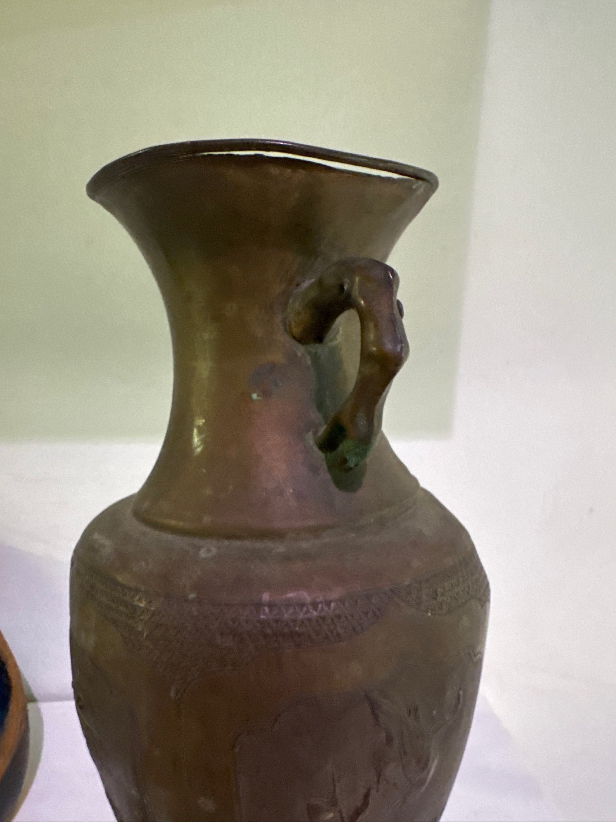 Antique bronze vase with aged patina and sculptural handles