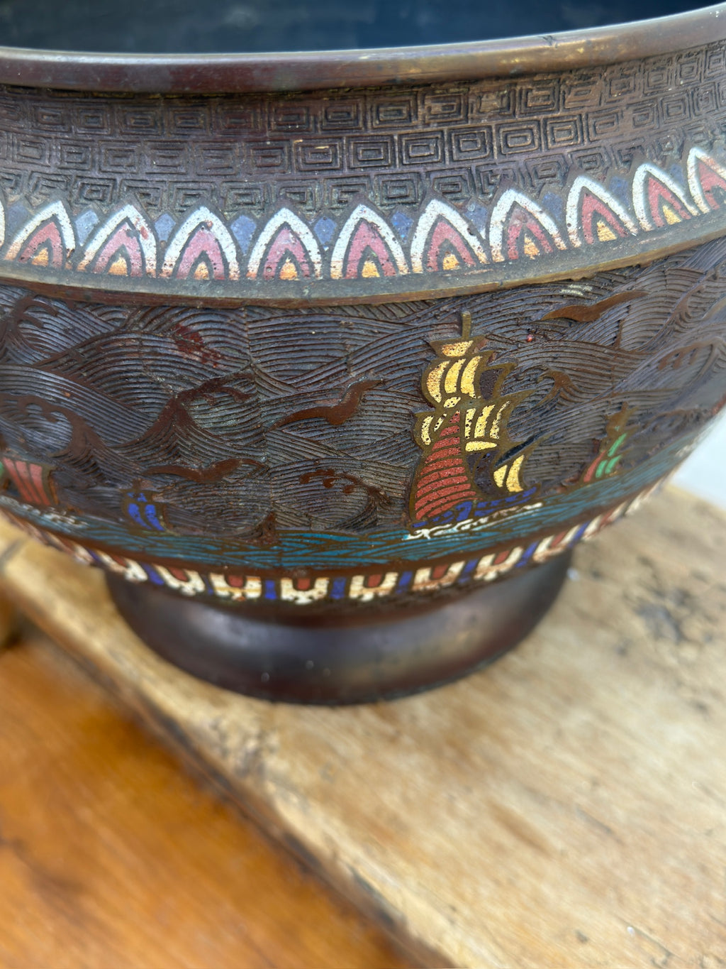 Side view of Champlevé enamel planter with maritime motifs