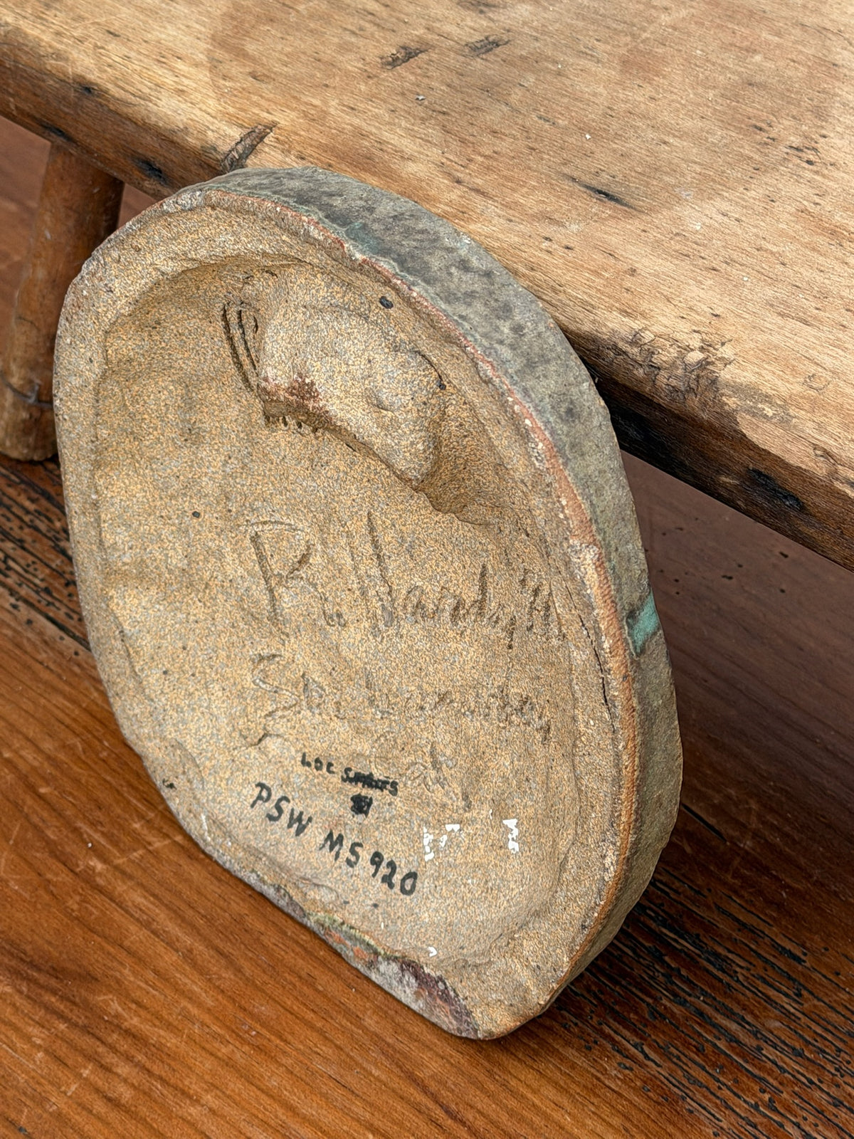 Reverse of face wall plaque signed R. Hardy and dated 1990