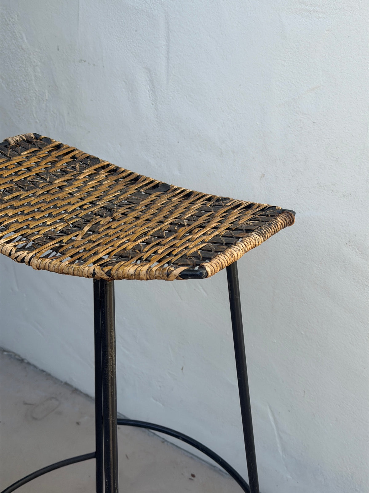 Side view of Arthur Umanoff wicker and iron bar stool