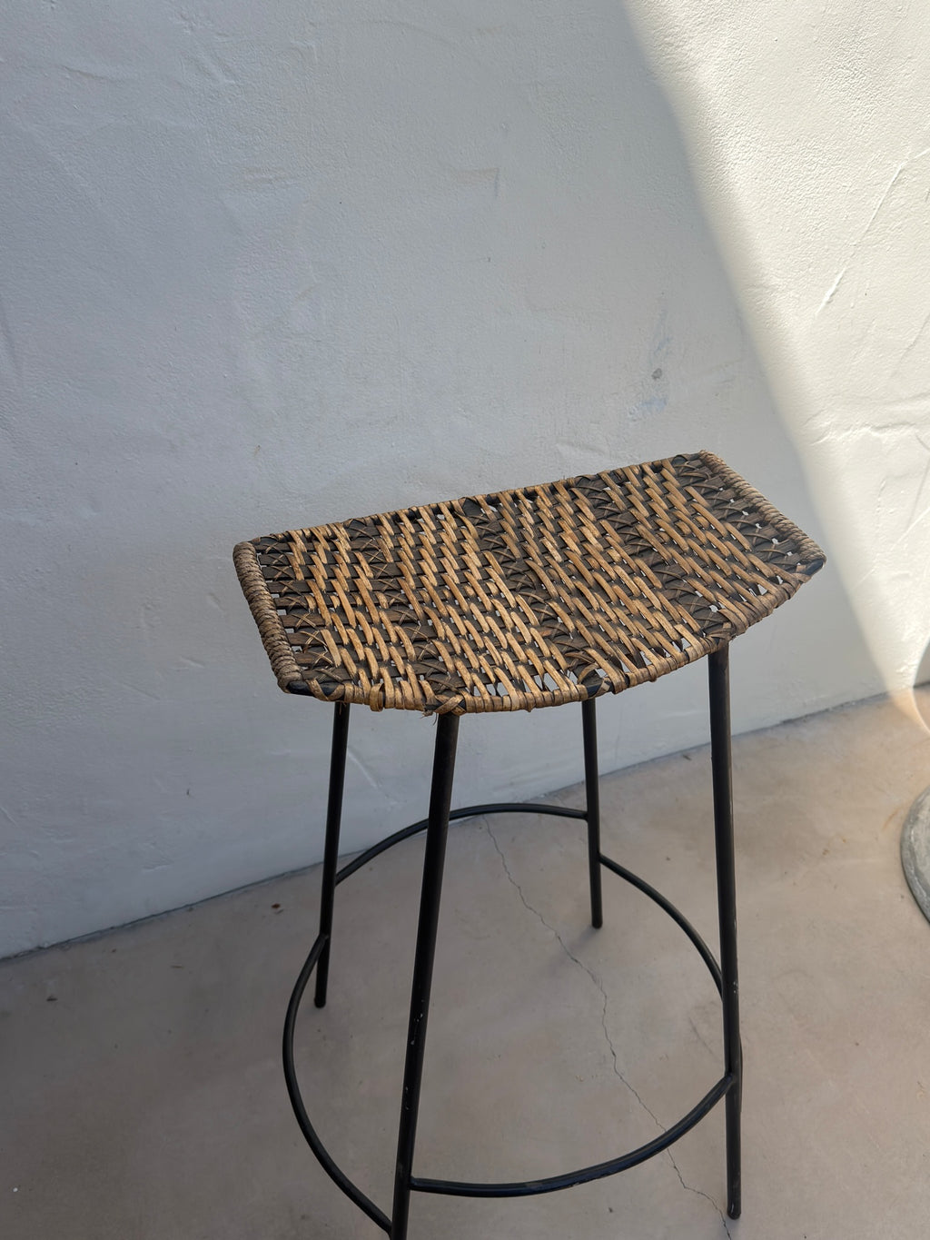 Woven wicker seat on Arthur Umanoff mid-century bar stool
