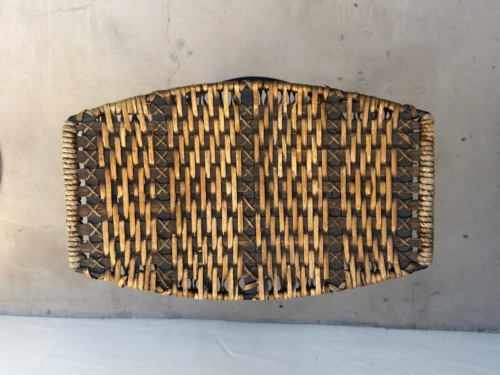 Close-up of woven wicker on vintage Arthur Umanoff bar stool
