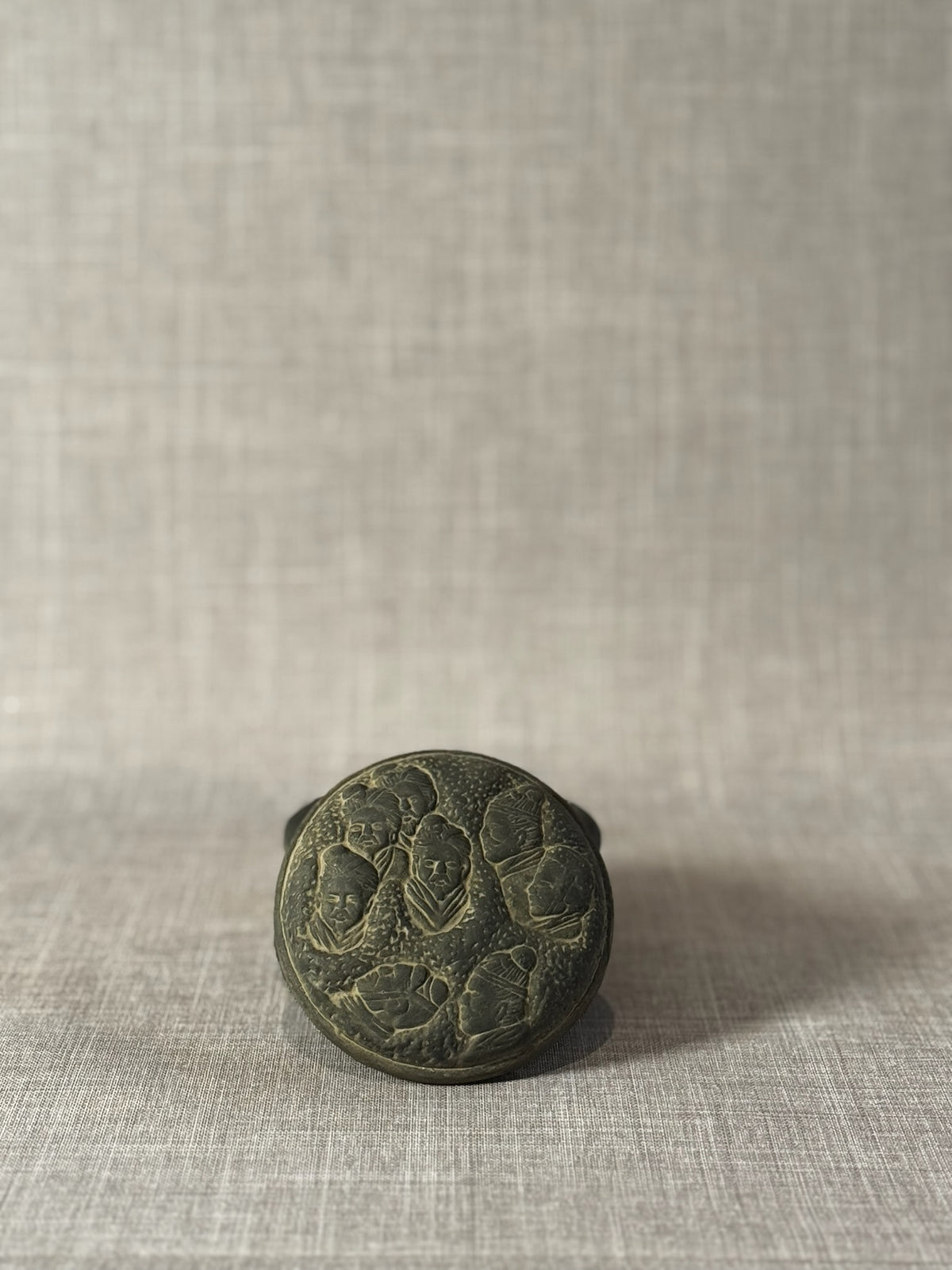 Hand-Carved Dark Grey Terracotta Lidded Vessel with Tribal Portrait Reliefs & Horse Motif