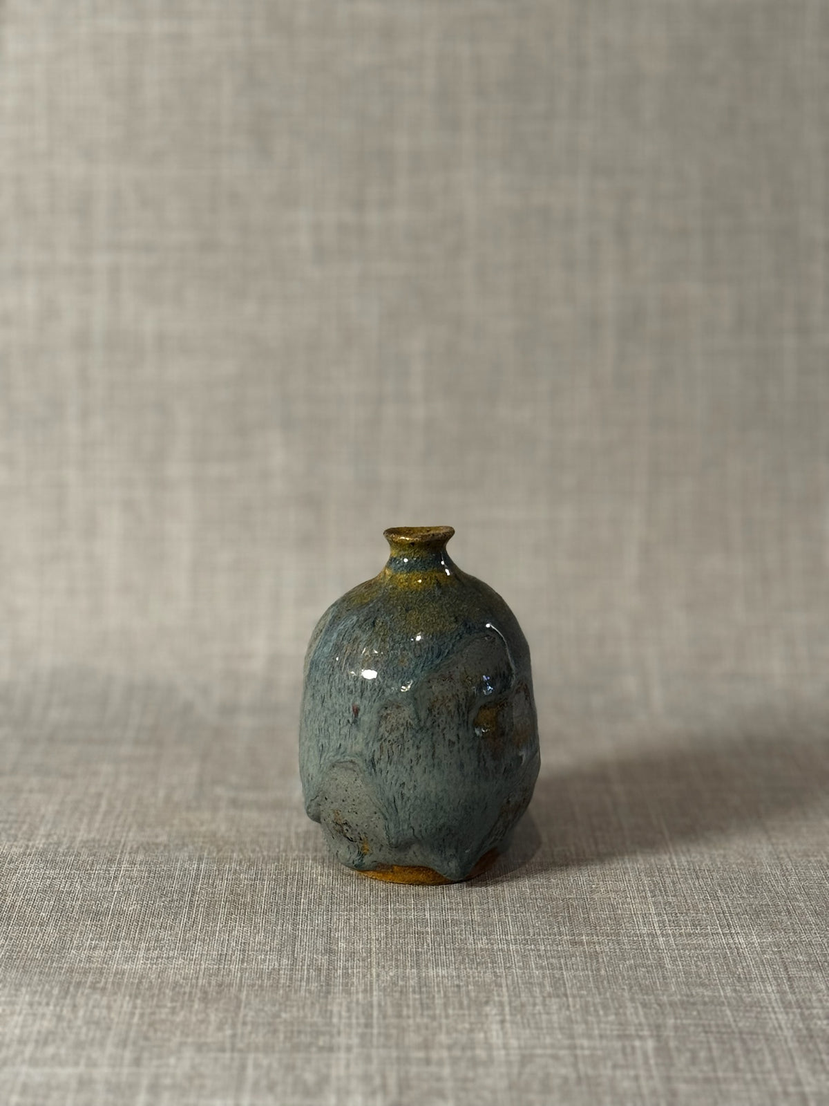 Handmade Studio Pottery Bud Vase with Flowing Blue-Green Lava Glaze & Ochre Accents