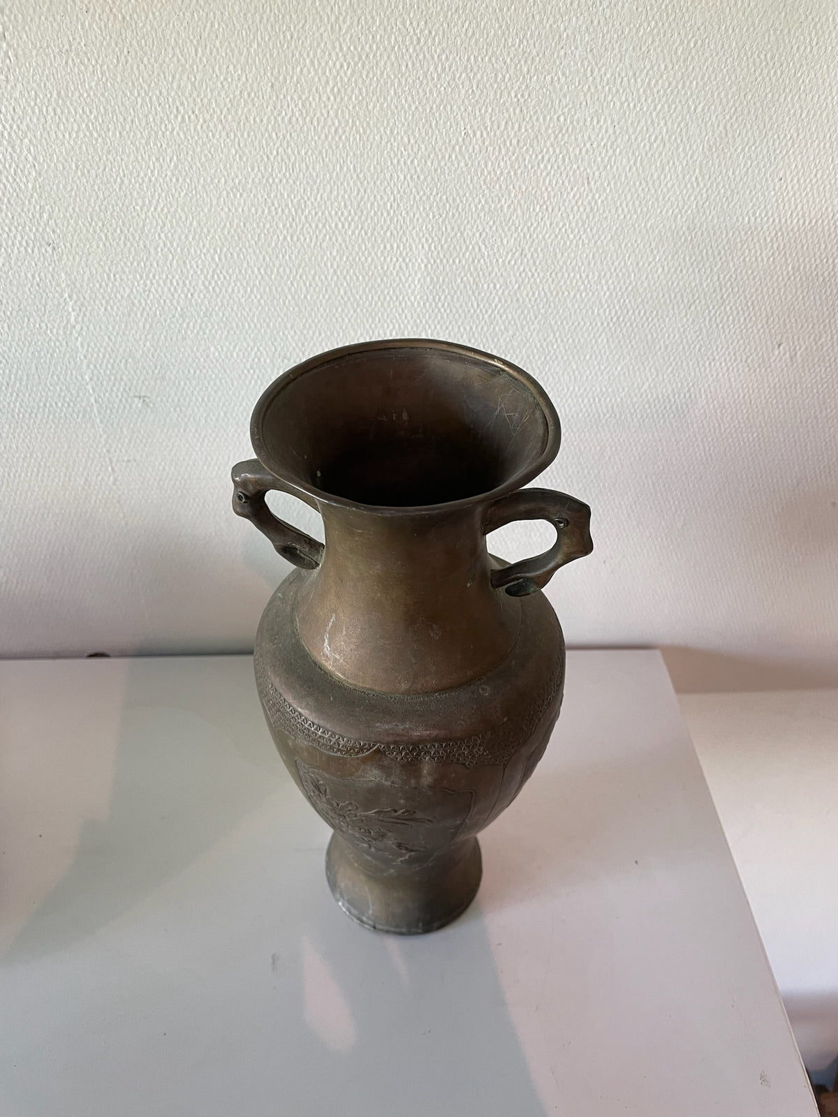Front view of antique Asian bronze decorative vase