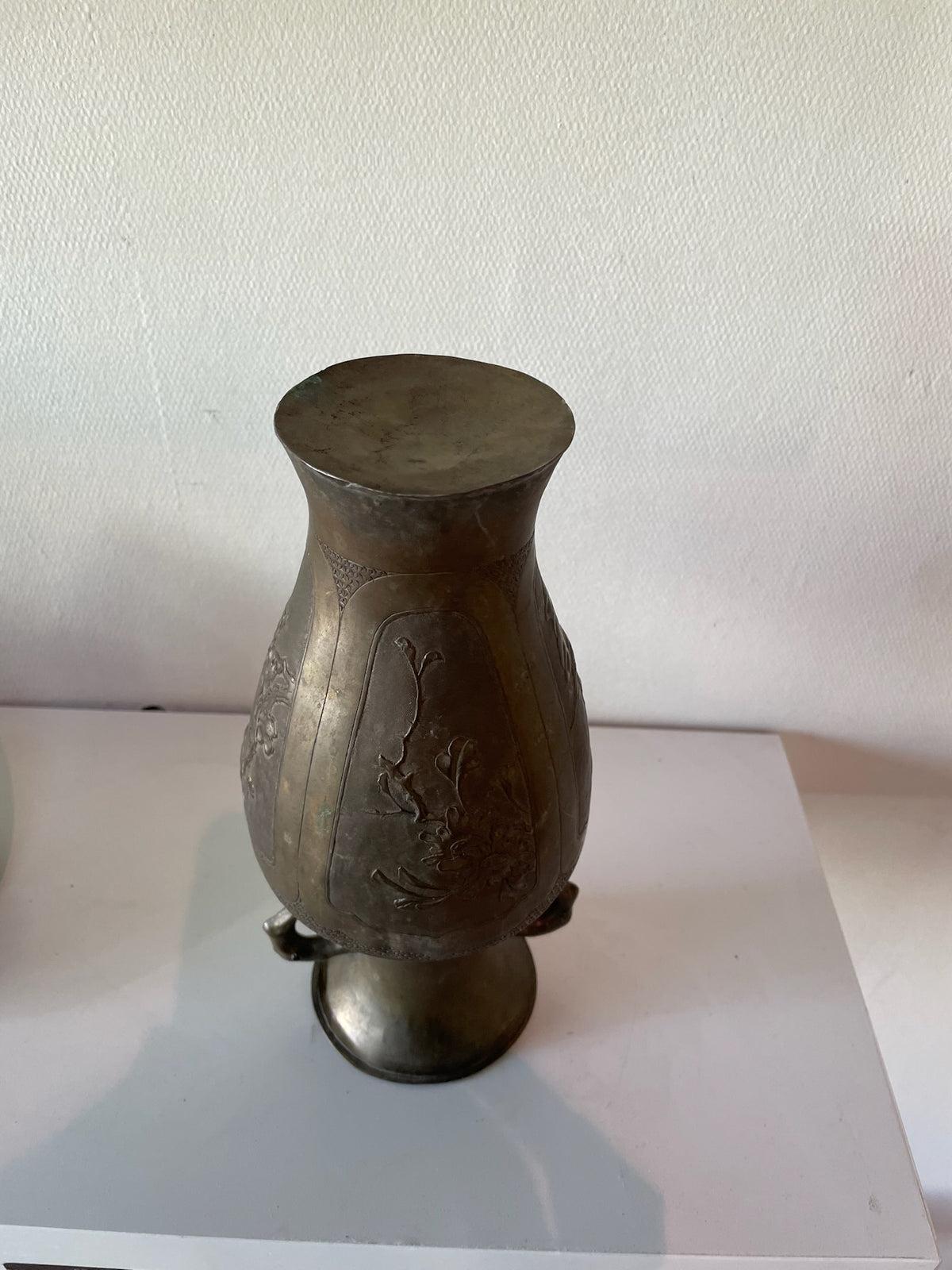 Asian bronze vase with loop handles and floral relief panels