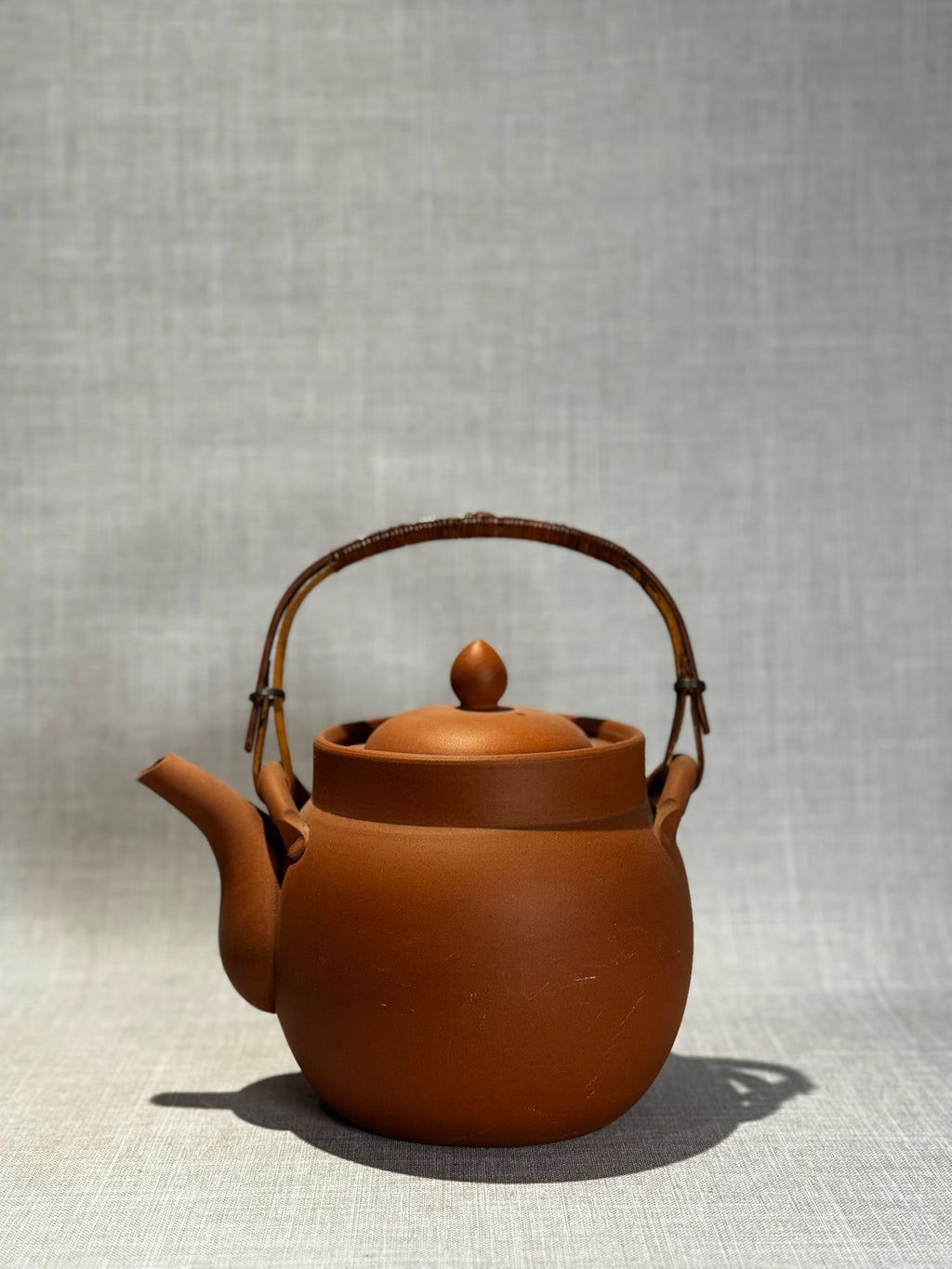 terracotta teapot with bamboo handle