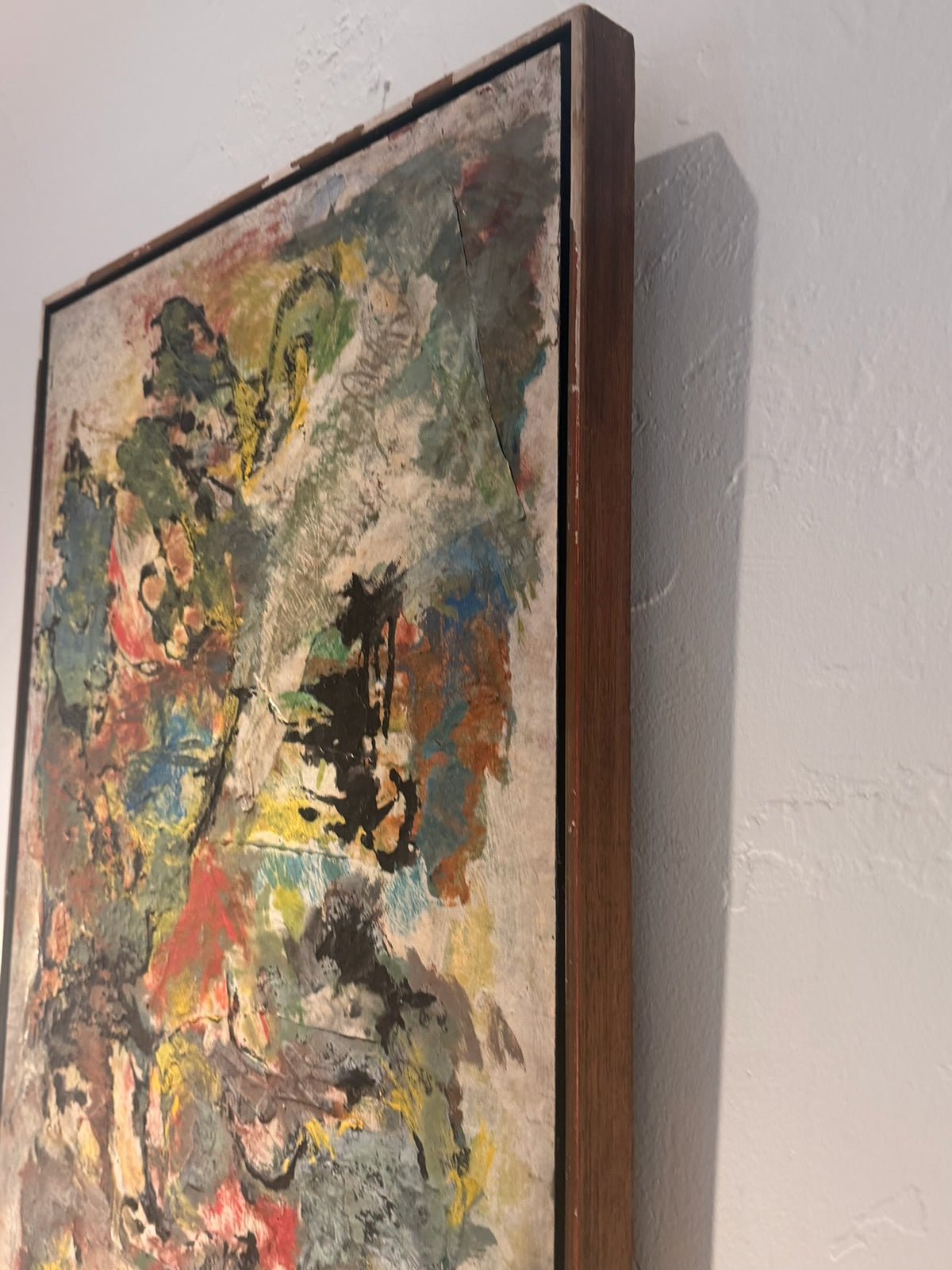 Side view showing dimensional impasto texture on abstract artwork