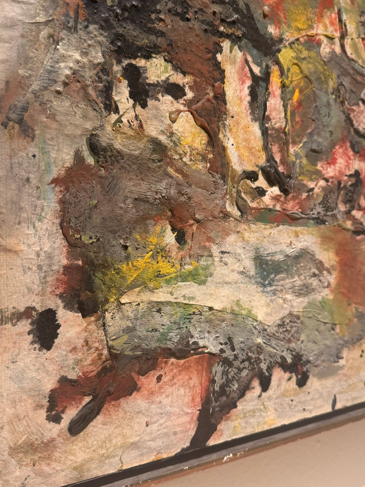 Detail of layered earth-tone surface on mixed media painting