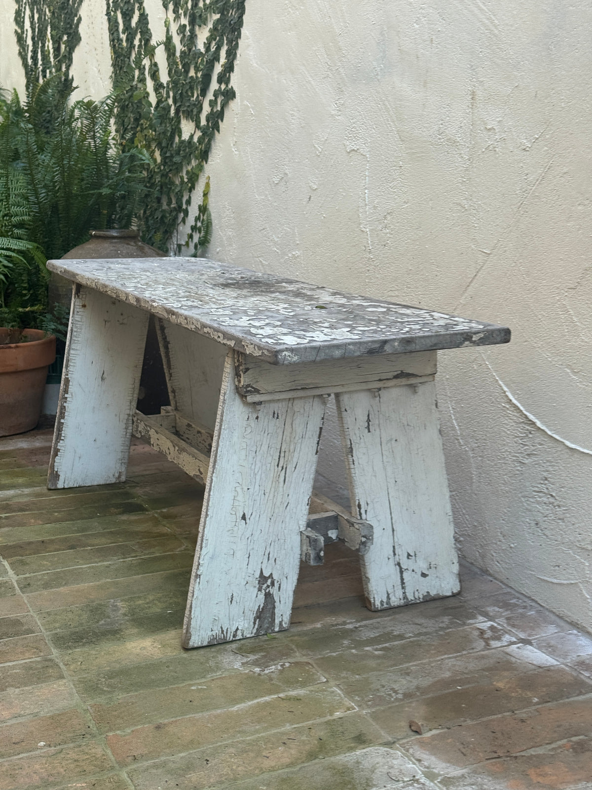 Side view of antique European wooden garden bench