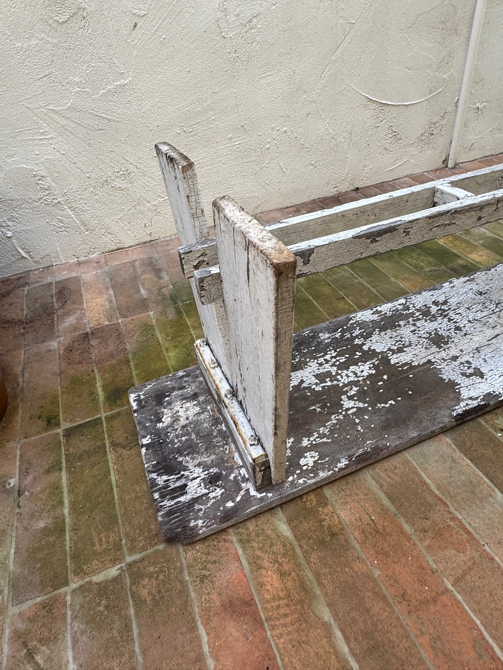 Underside of antique wood bench showing traditional construction