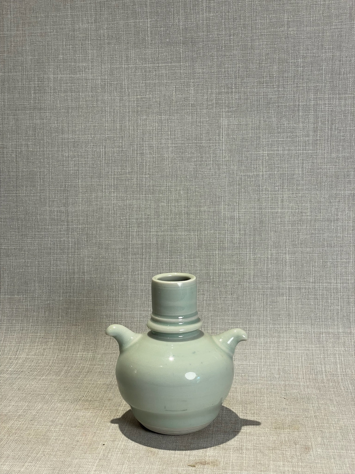 Elegant Pale Blue Studio Pottery Vase with Dual Sculpted Handles – Handcrafted Ceramic Art