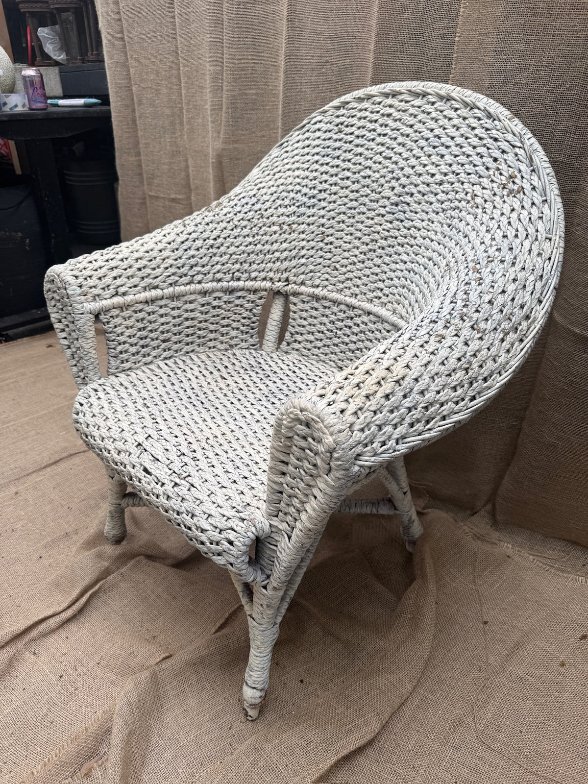 Close-up of handwoven wicker on vintage white seating