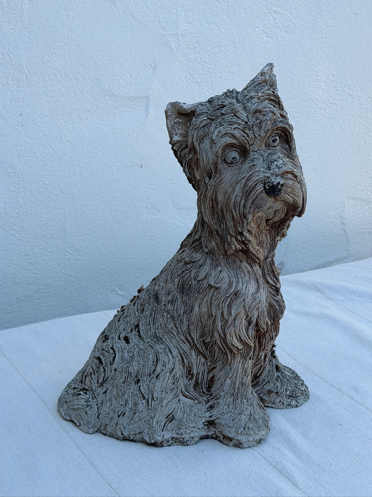 Weathered dog statue for garden or patio