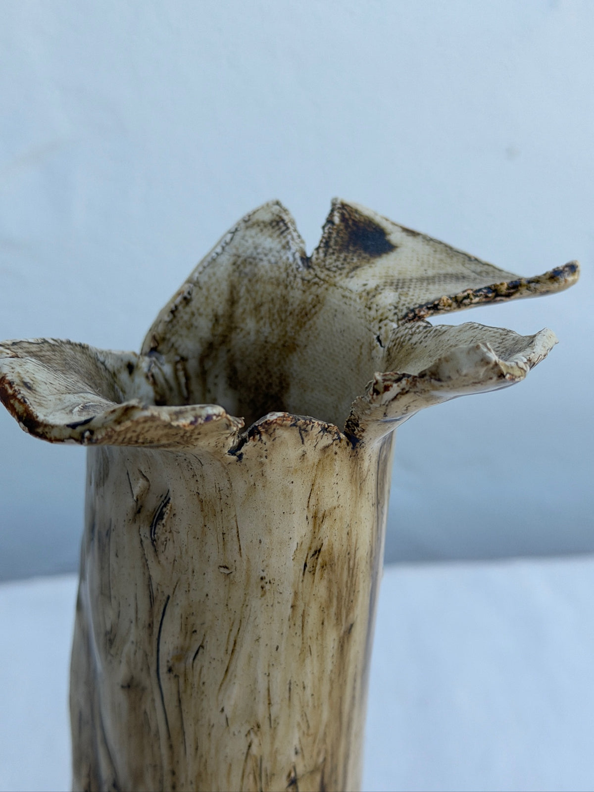 Sculptural ceramic vase with ruffled flower-like rim