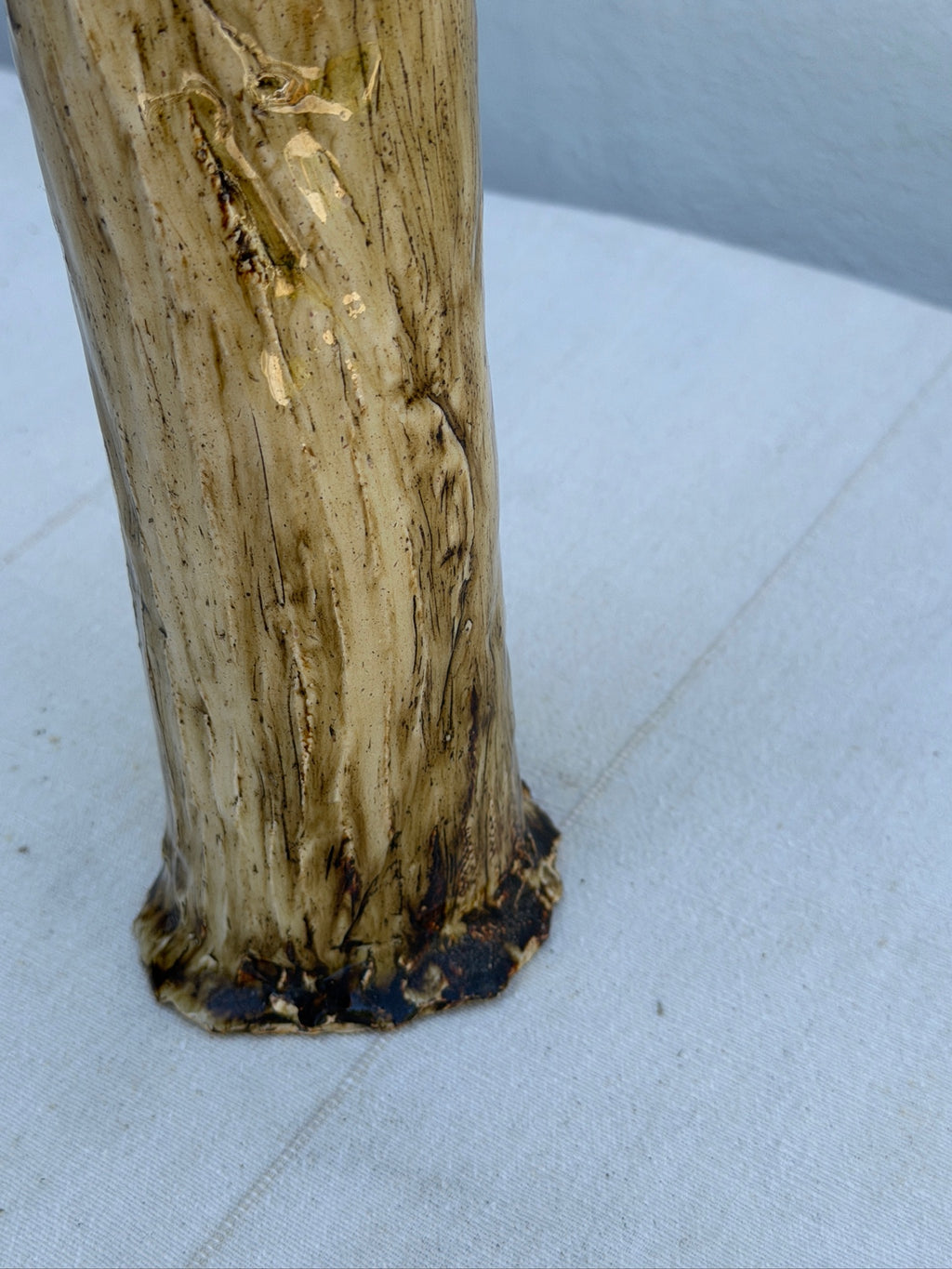 Close-up of tree-bark texture on ceramic vase