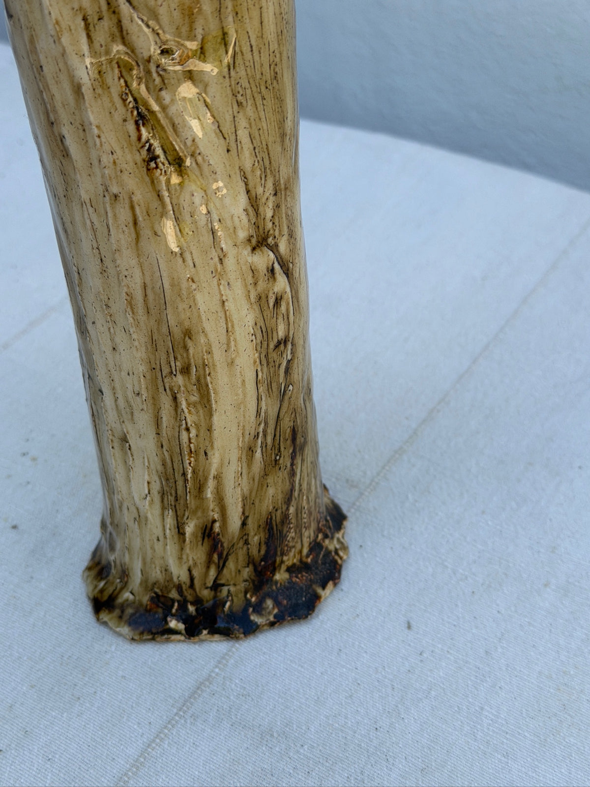 Close-up of tree-bark texture on ceramic vase