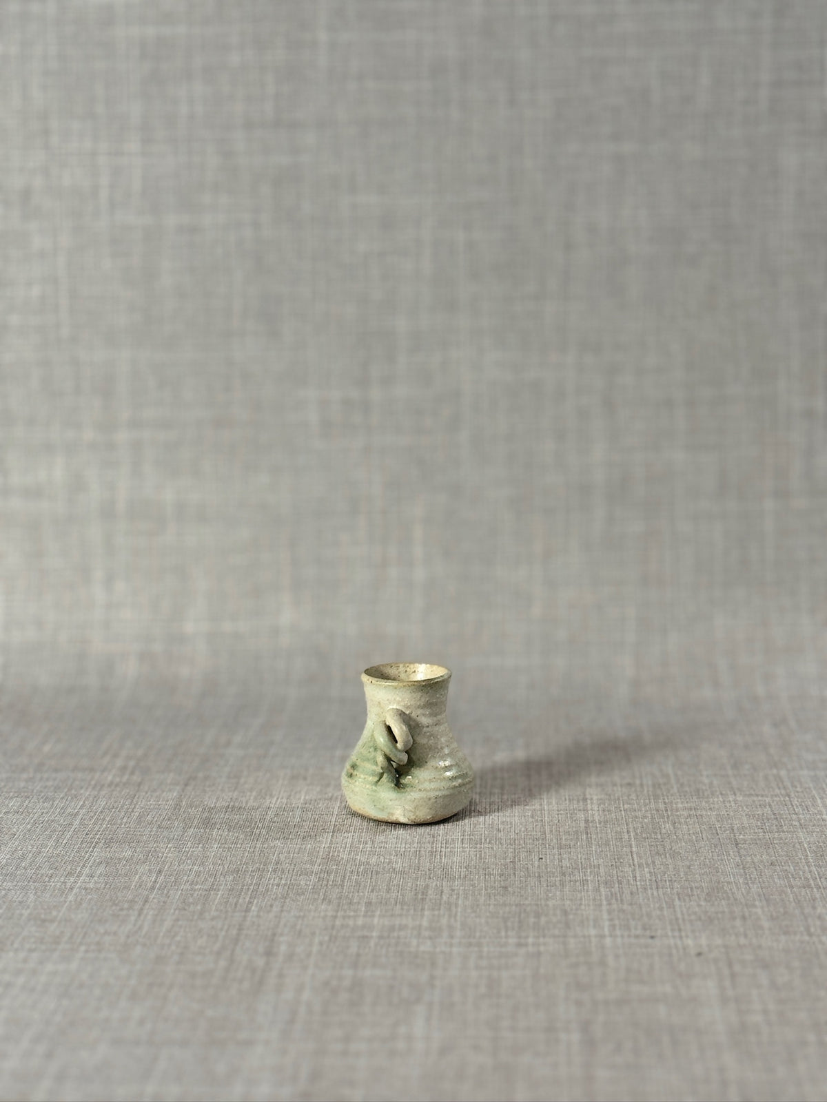 Signed Miniature Studio Pottery Jug – Hand-Thrown Celadon Green Stoneware Vessel with Sculptural Handle