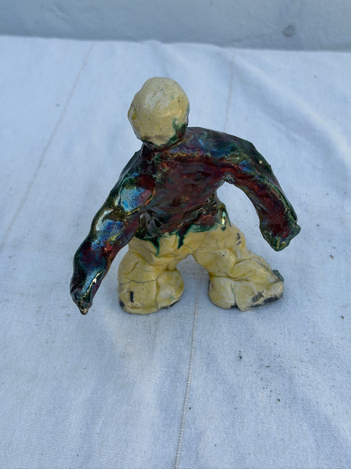 Close-up of glaze on handbuilt ceramic sculpture