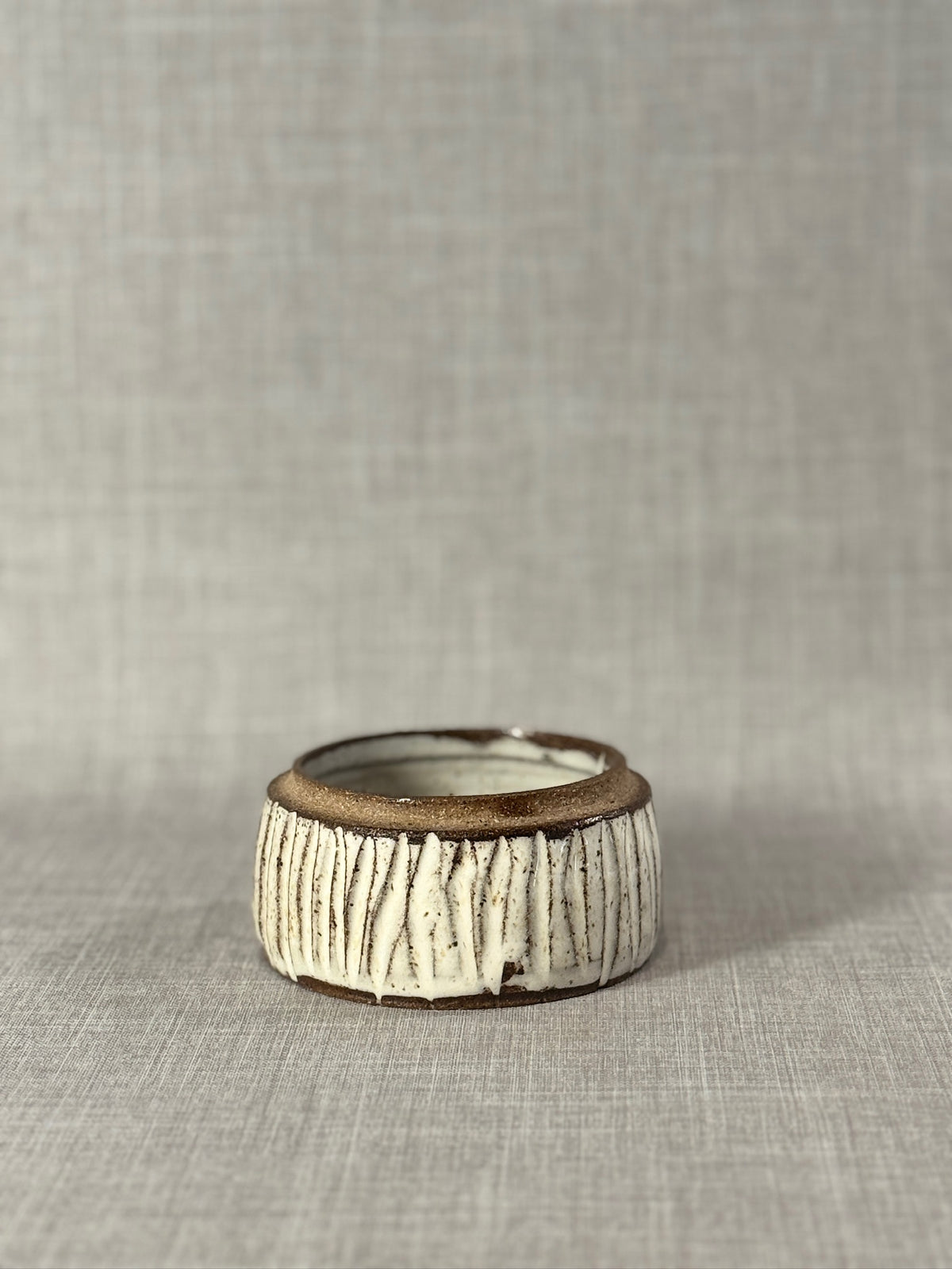 handmade stoneware bowl with carved texture design