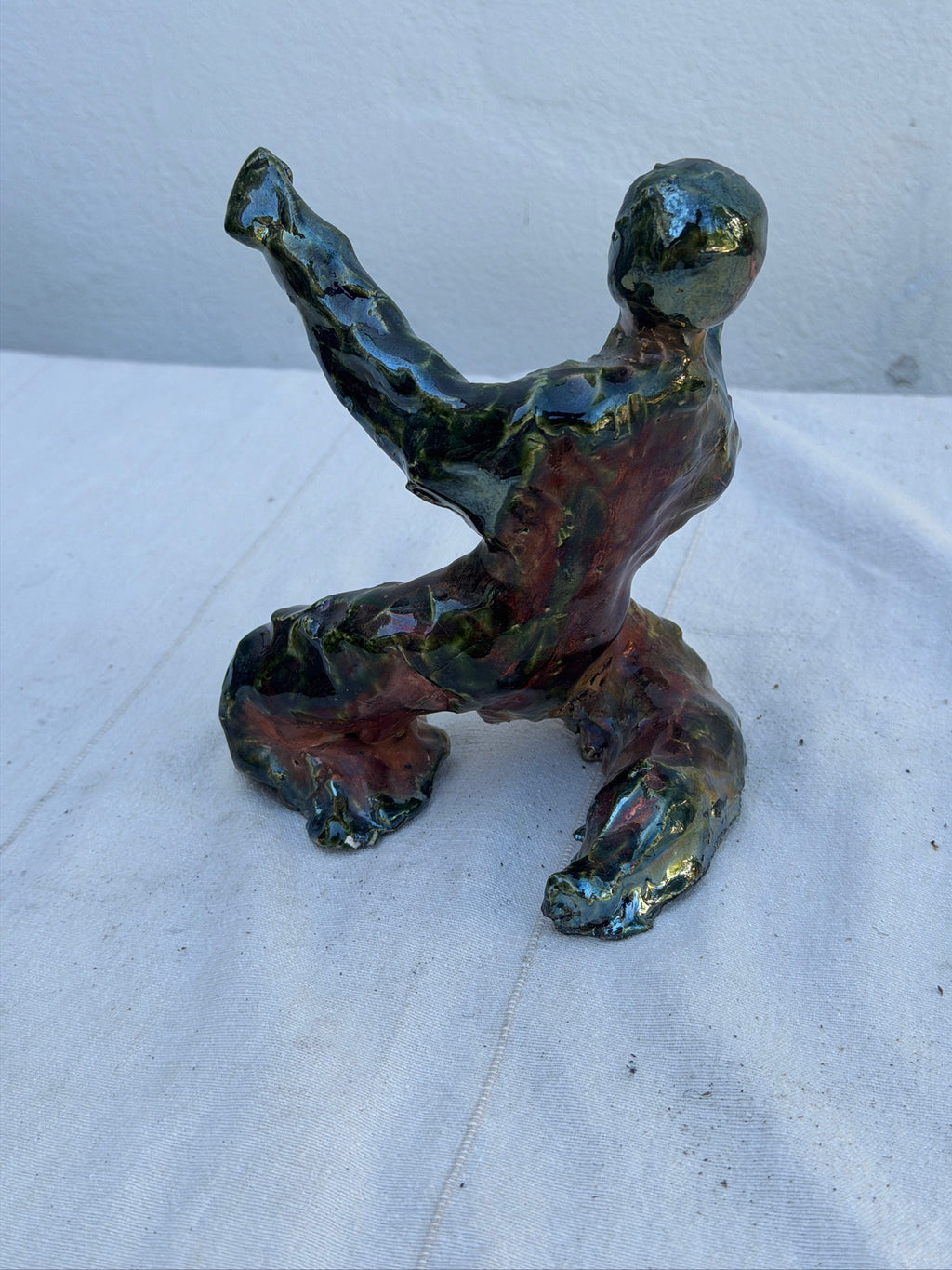 Back view of abstract ceramic studio art figure
