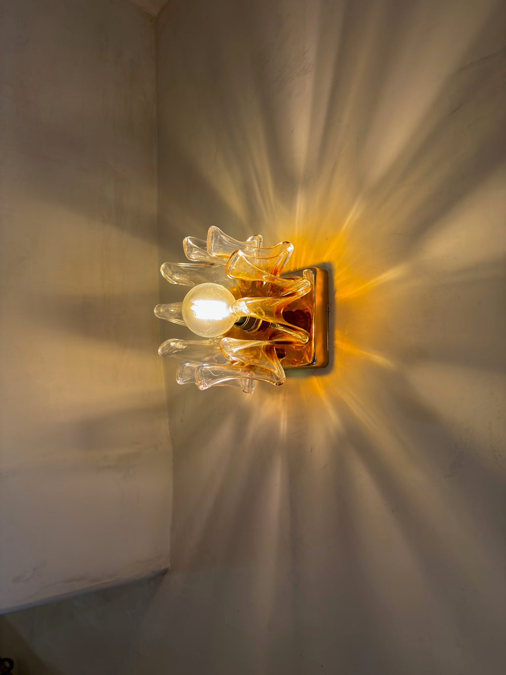 Close-up of textured orange and clear Murano glass on vintage Mazzega wall sconce — Hommes and Gardens, Lights + Lanterns Collection, Home Decor, Interior Designer, Luxury Design, Art, Objects, Italian Design, Murano Glass, Decorative Lighting, Mid-Century Modern, Collectible Design.