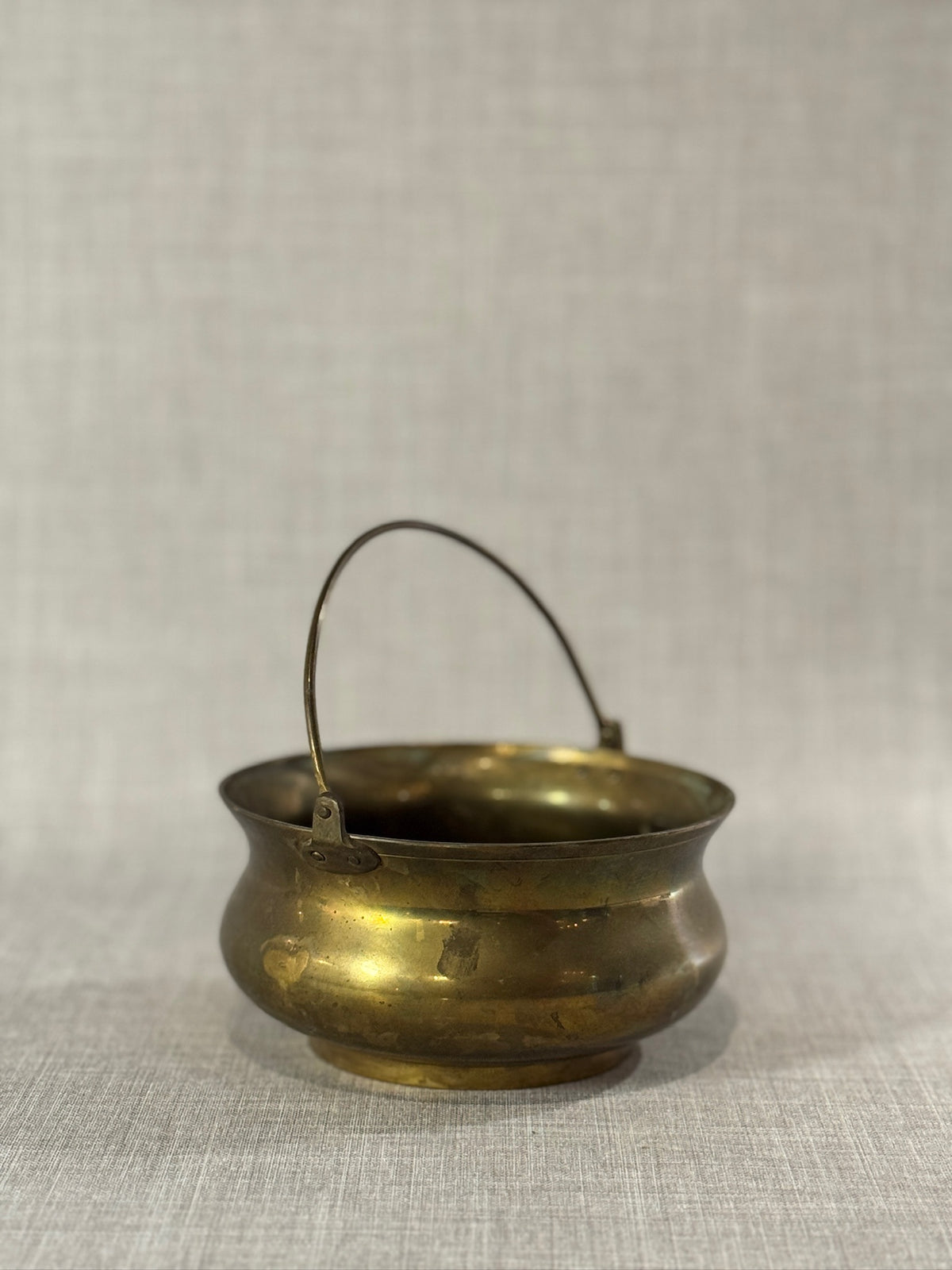 handcrafted brass hanging bowl with aged patina