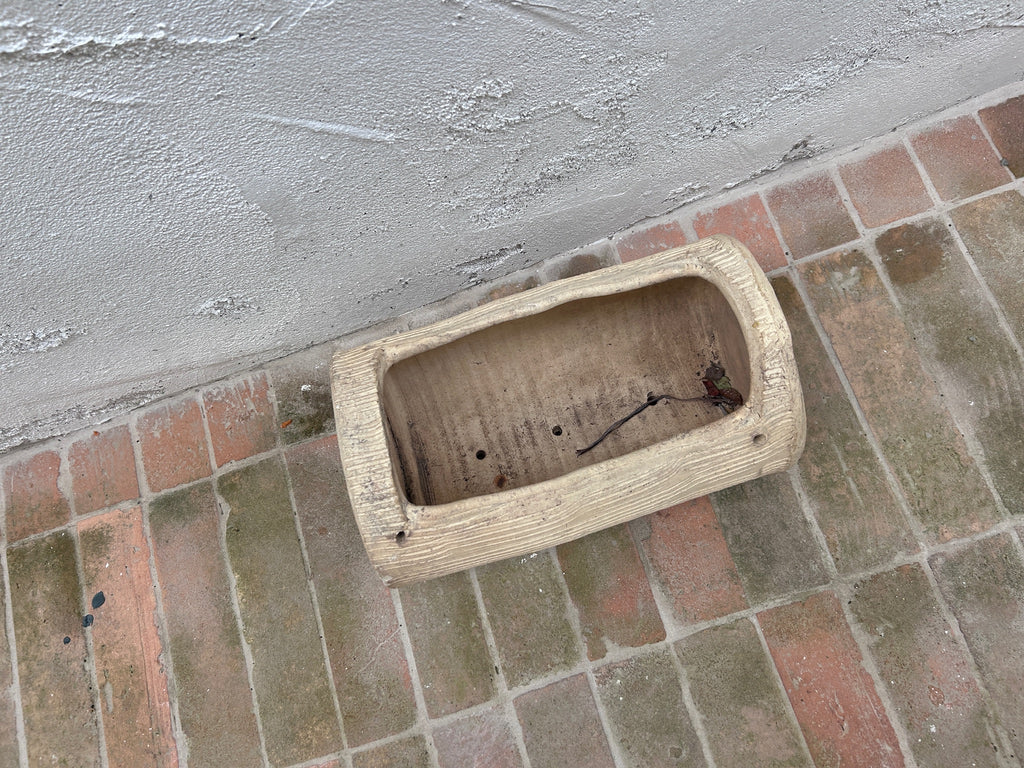 Interior of cast concrete faux bois garden planter