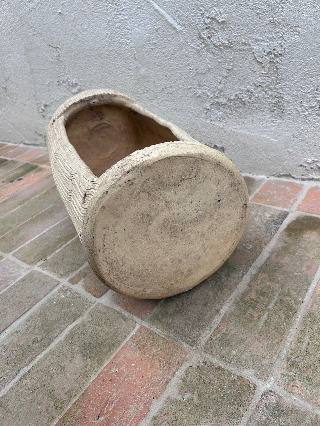 End view of sculptural tree trunk planter