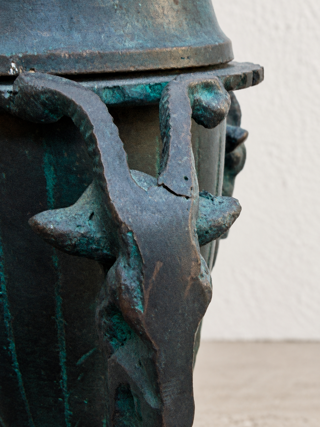 Detail of patinated metalwork on sculptural incense burner