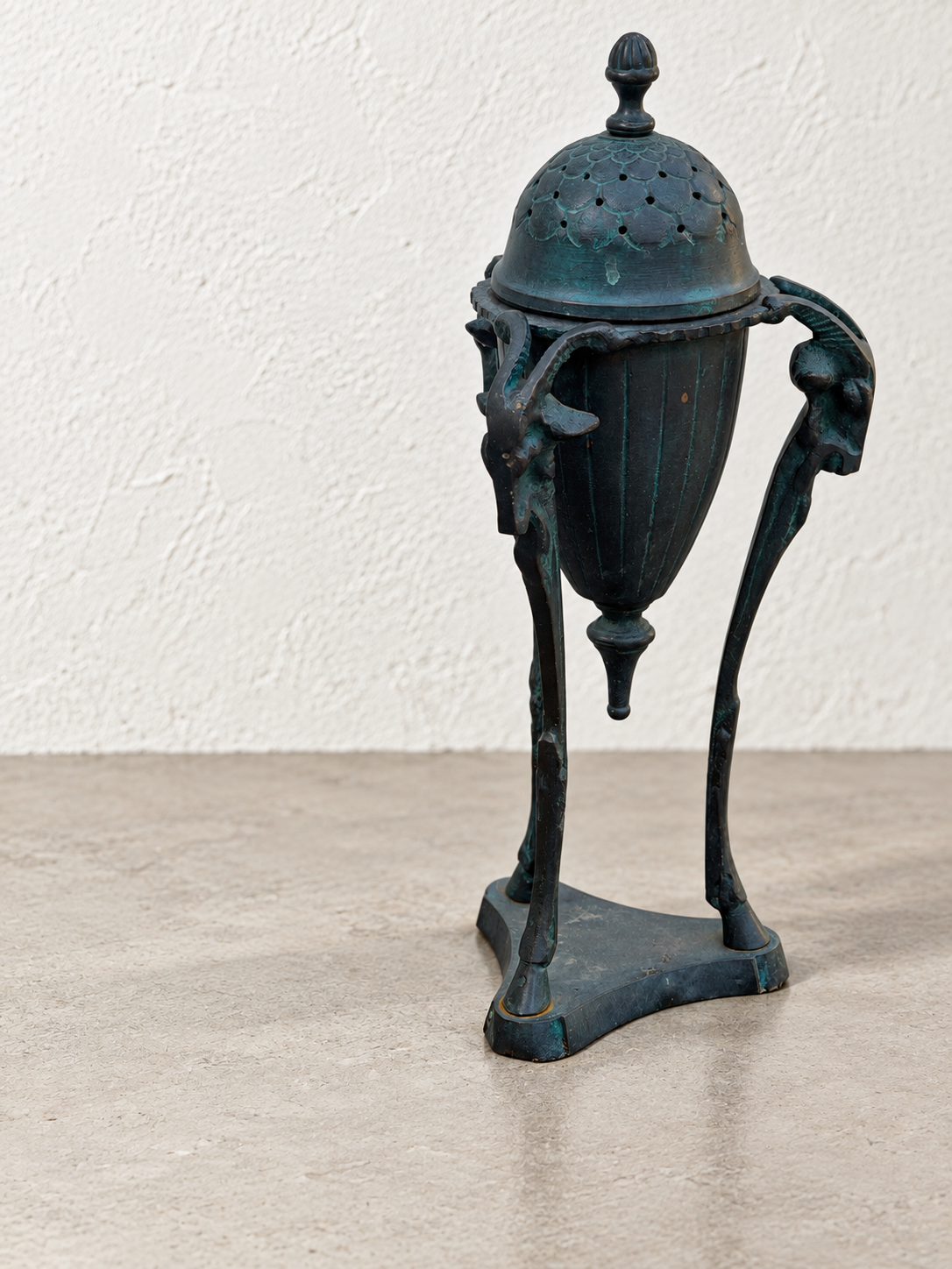 Sculptural figural incense burner with dark aged metal finish