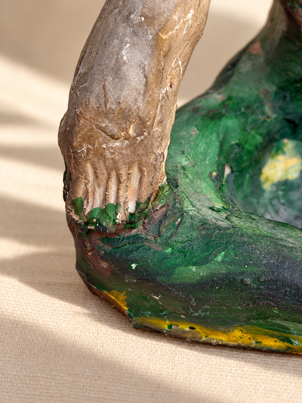 Detail of handcrafted surface on figural studio pottery sculpture