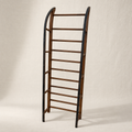 Primitive wood sled with open ladder frame and iron-shod runners