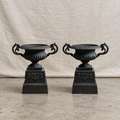 Pair of 19th-century Neoclassical black cast iron garden urns with C-scroll handles, weathered patina and matching plinth bases — Hommes and Gardens, Pots + Planters Collection, Objects + Curiosities Collection, Home Decor, Landscape Architect, Interior Designer, Outdoor Living, Outdoor Decorations, Garden Design, Home Design, Luxury Design, Art, Furniture, Objects, Best Gifts, Nature, Backyard, Yard.
