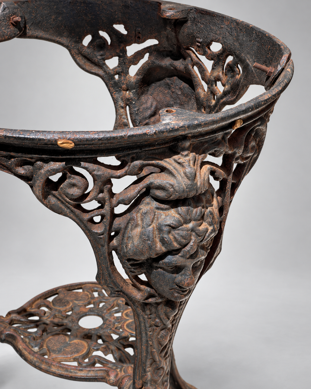 Close-up of ornate cast iron relief and shield motif on mid-century Britannia pedestal table — Hommes and Gardens, Furniture Collection, Objects + Curiosities Collection, Home Decor, Interior Designer, Luxury Design, Art, Furniture, Objects, Decorative Ironwork, European Design, Vintage Decor.