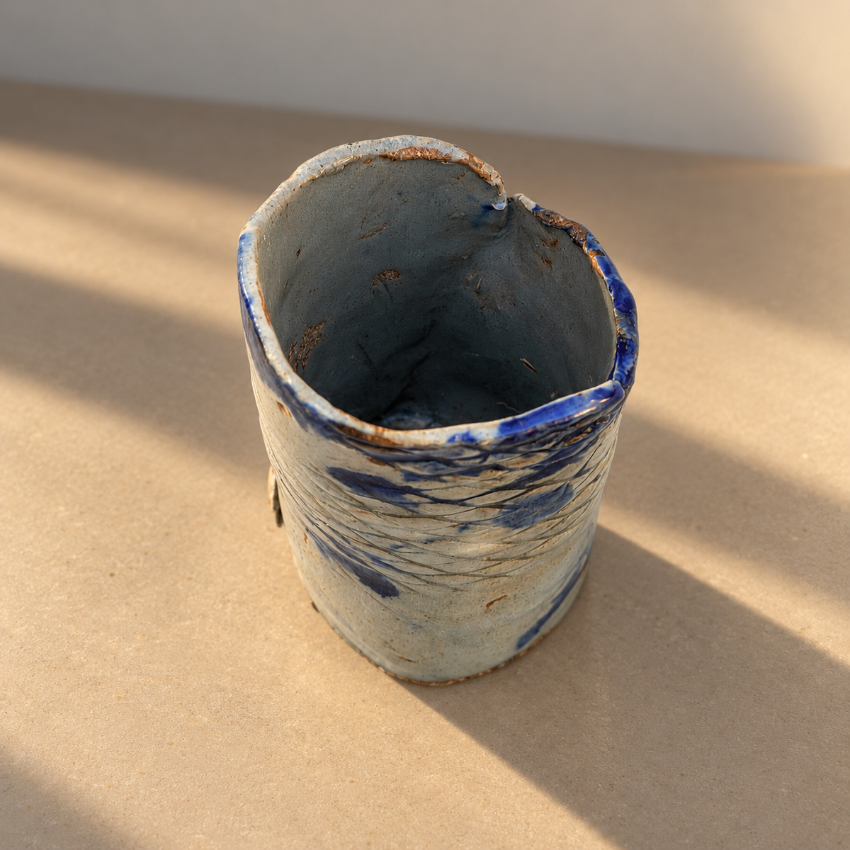 Top view of blue studio pottery vase showing the opening