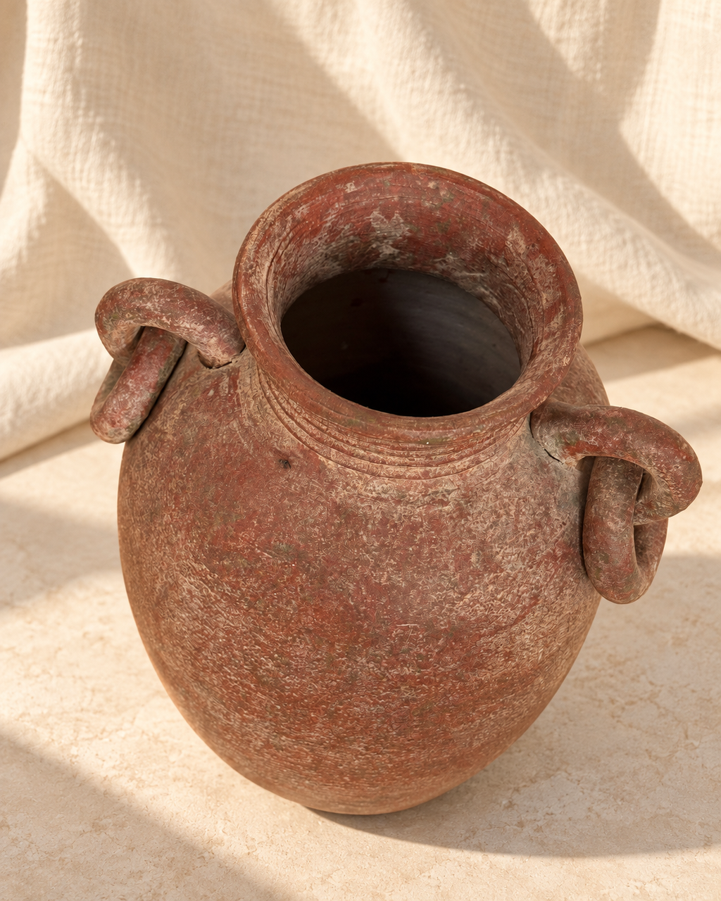 Close-up of weathered terracotta surface on antique amphora